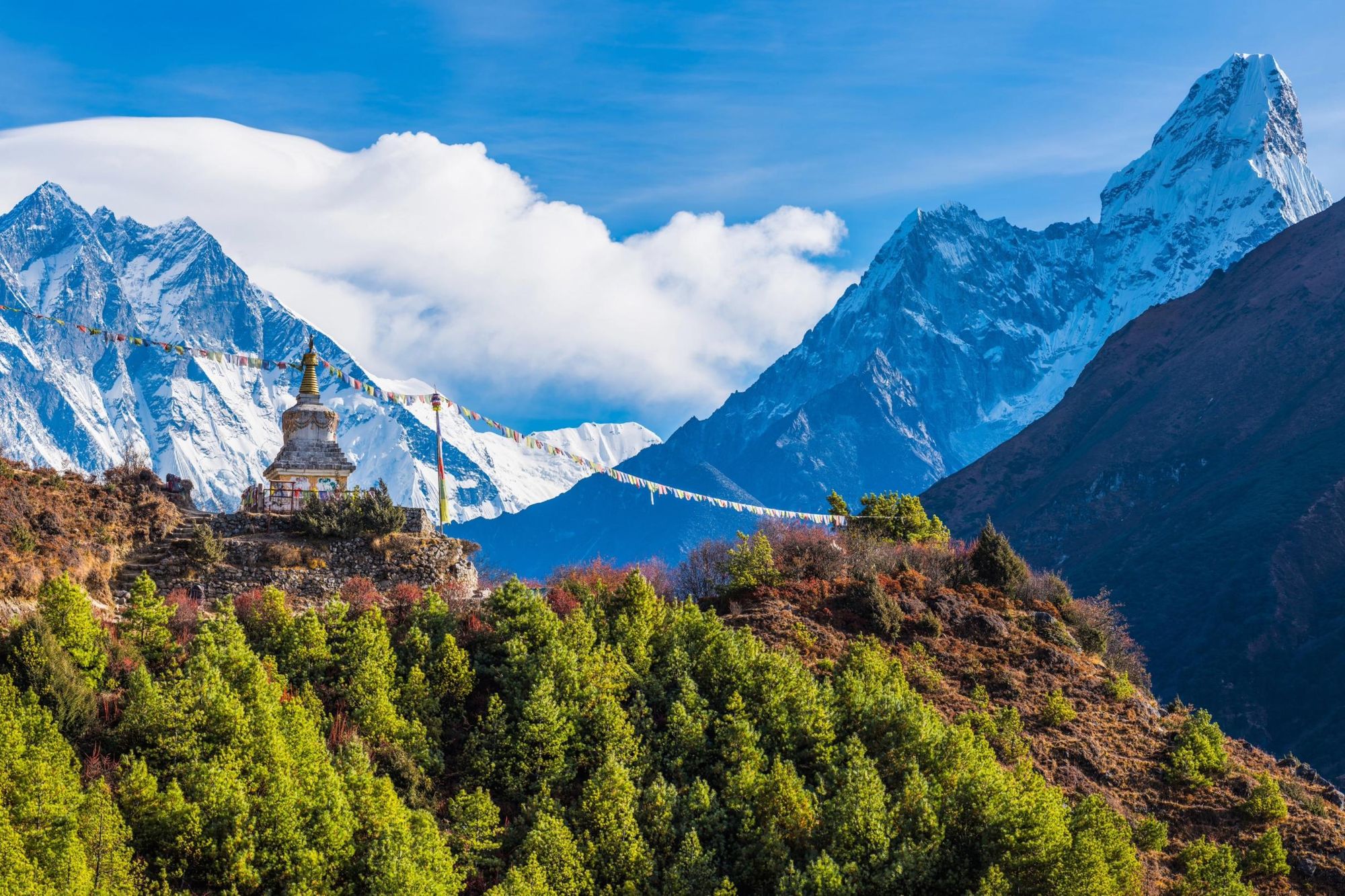The white stupa perched atop a hill along the Everest Base Camp Trek. Photo: Getty.