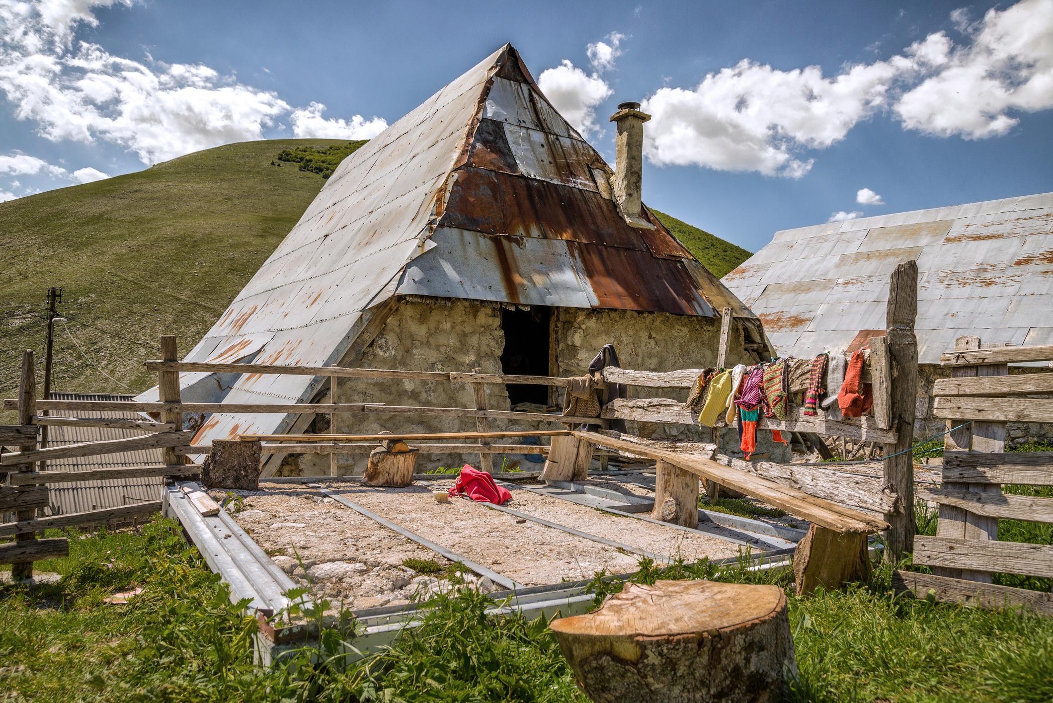 A local house in Lukomir, with freshly-knitted socks hanging on the old wooden fence. Photo: Getty