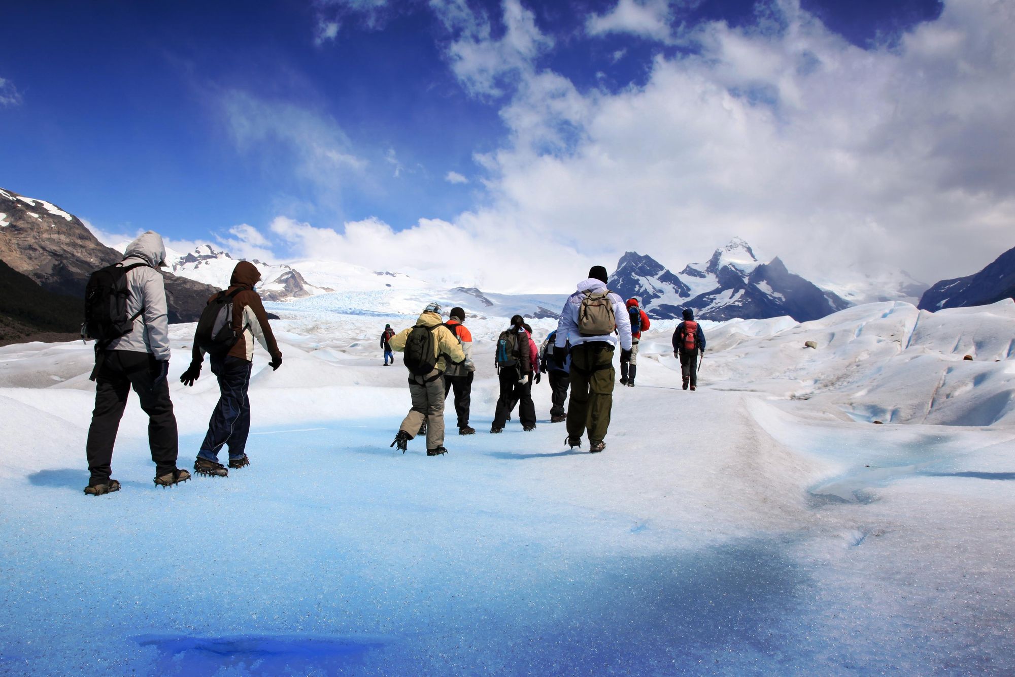 Hikers dressed up to hike across Perito Moreno Glacier. Photo: Getty.