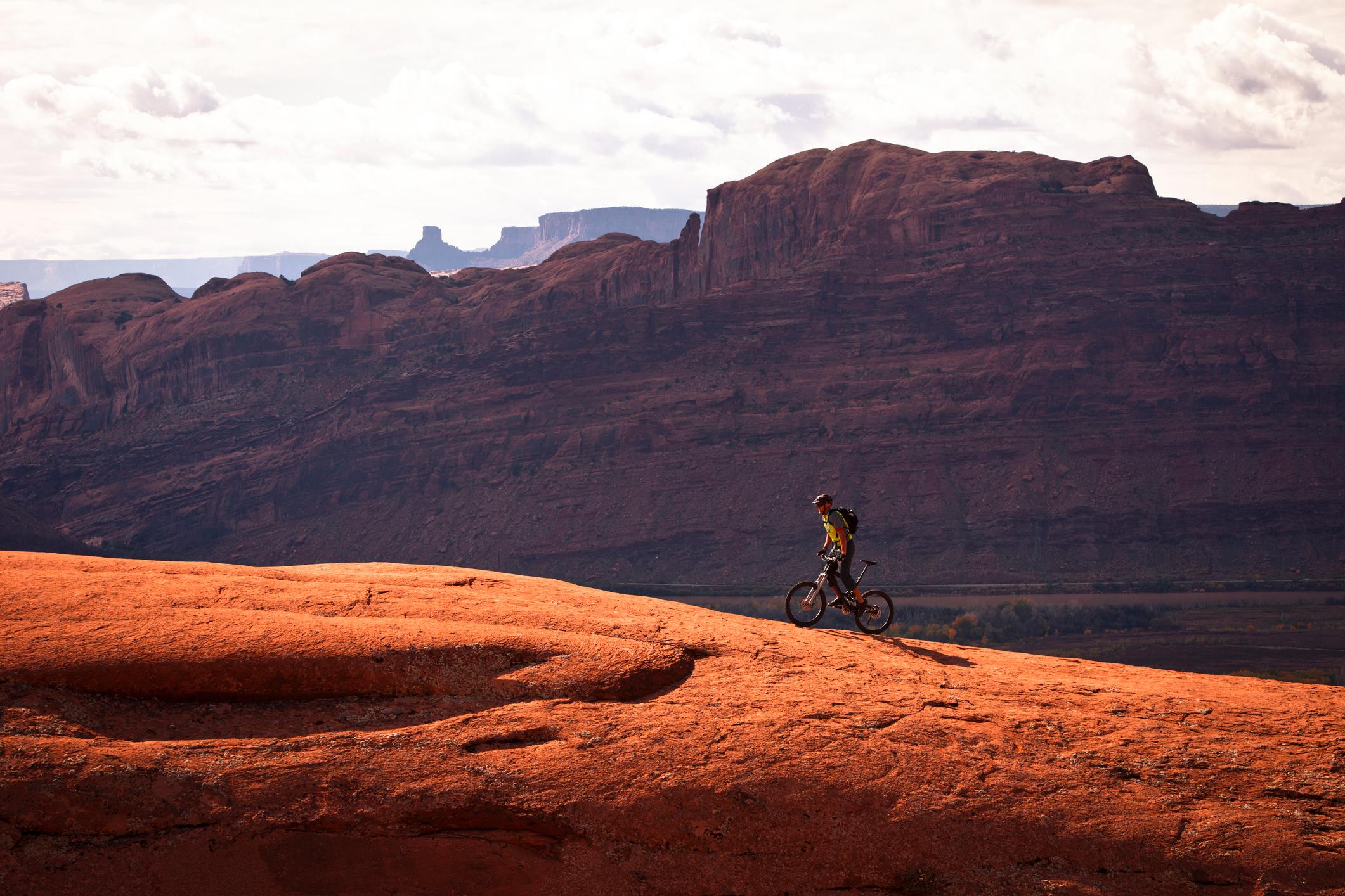A mountain biker riding on the legendary red rocks of Moab. Photo: Getty
