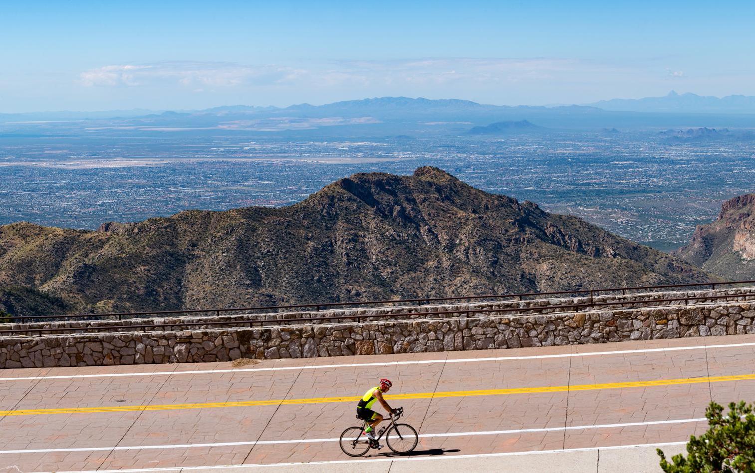 A road cyclist tackles the climb of Mt. Lemmon, with a sweeping view of Tucson, Arizona beyond. Photo: Getty