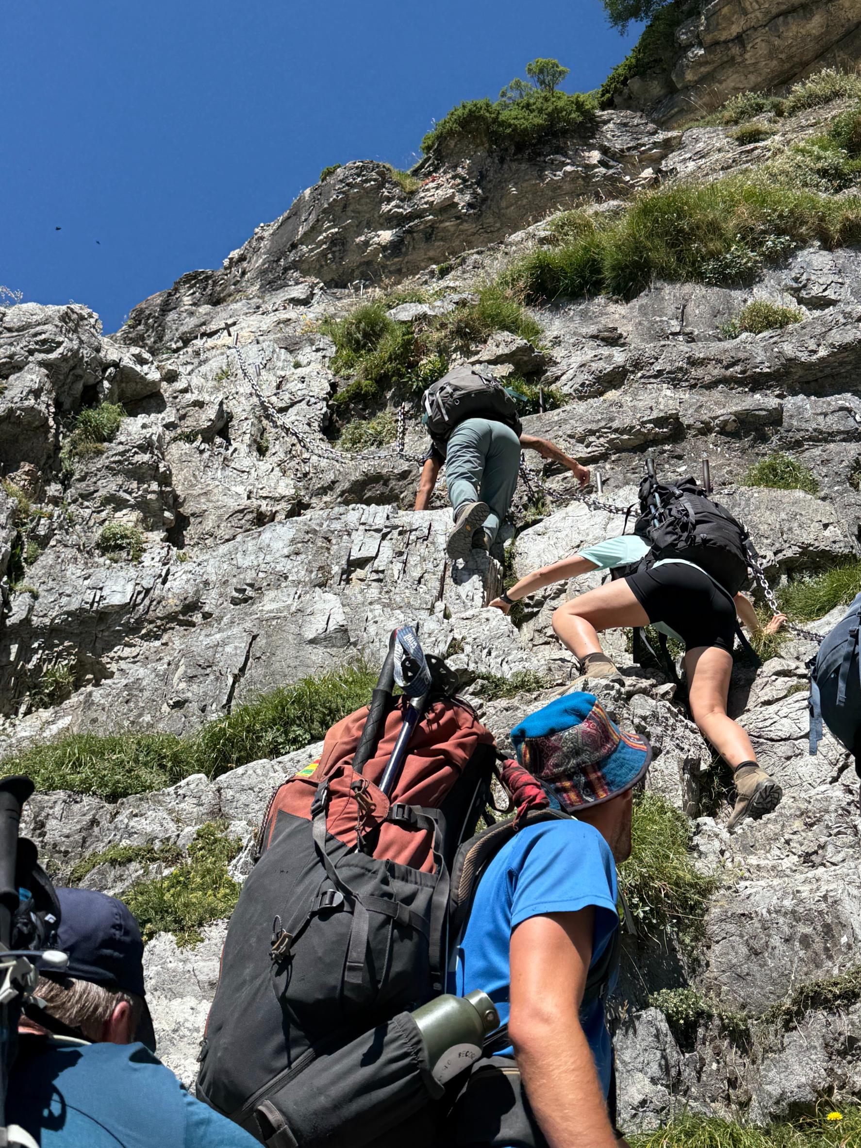 A treacherous piece of trail on the High Route of the Lost, requiring hands on chain for balance. Photo: Lucy Davies