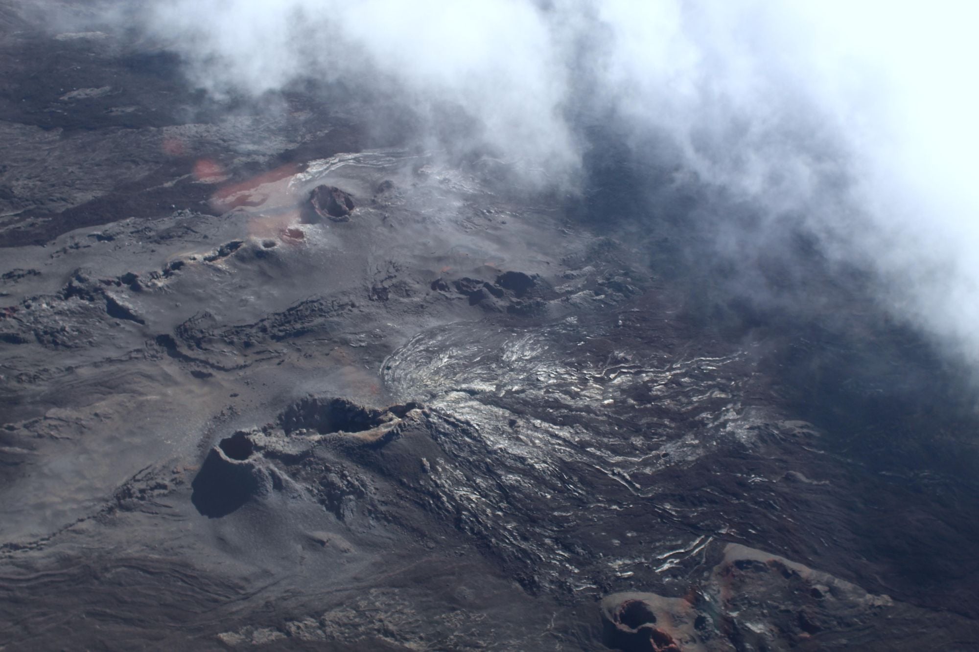 The fiery black surface of Piton de la Fournaise, up which you hike to reach the rim. Photo: Stuart Kenny