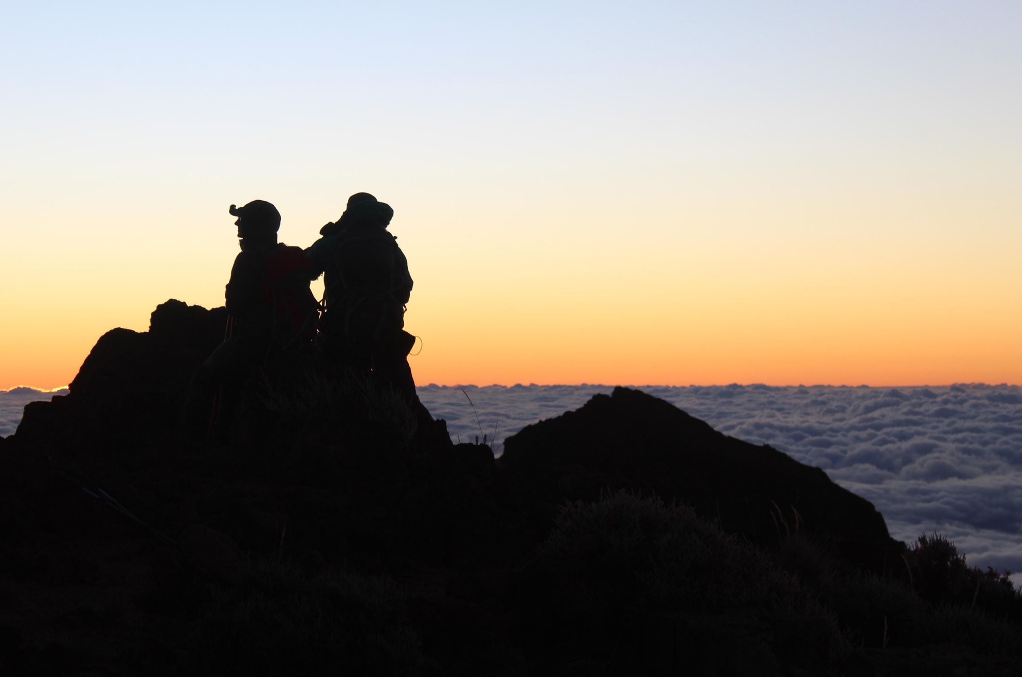 The silhouette of our team on the summit of Piton des Neiges. Photo: Stuart Kenny