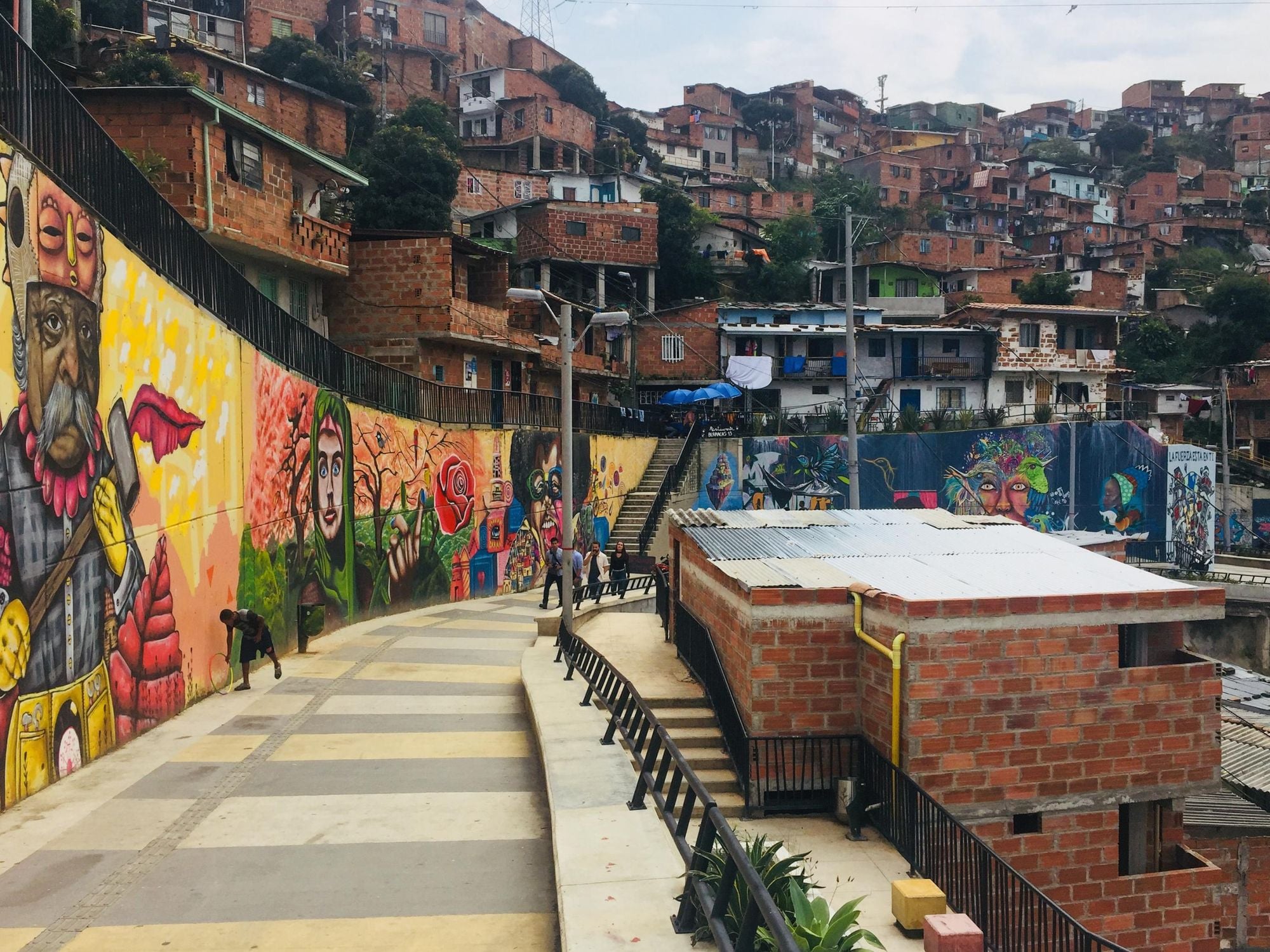 Graffiti mural paintings in the colourful streets of Comuna 13 in Medellin in the early morning. Photo: Getty