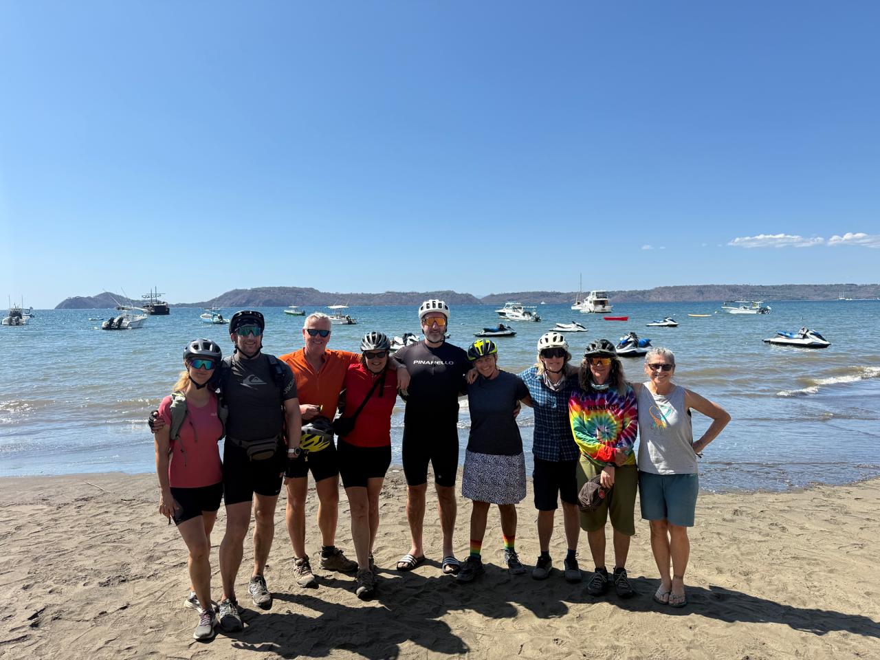 Group of adventurers on the beach at the Pacific Coast of Costa Rica.