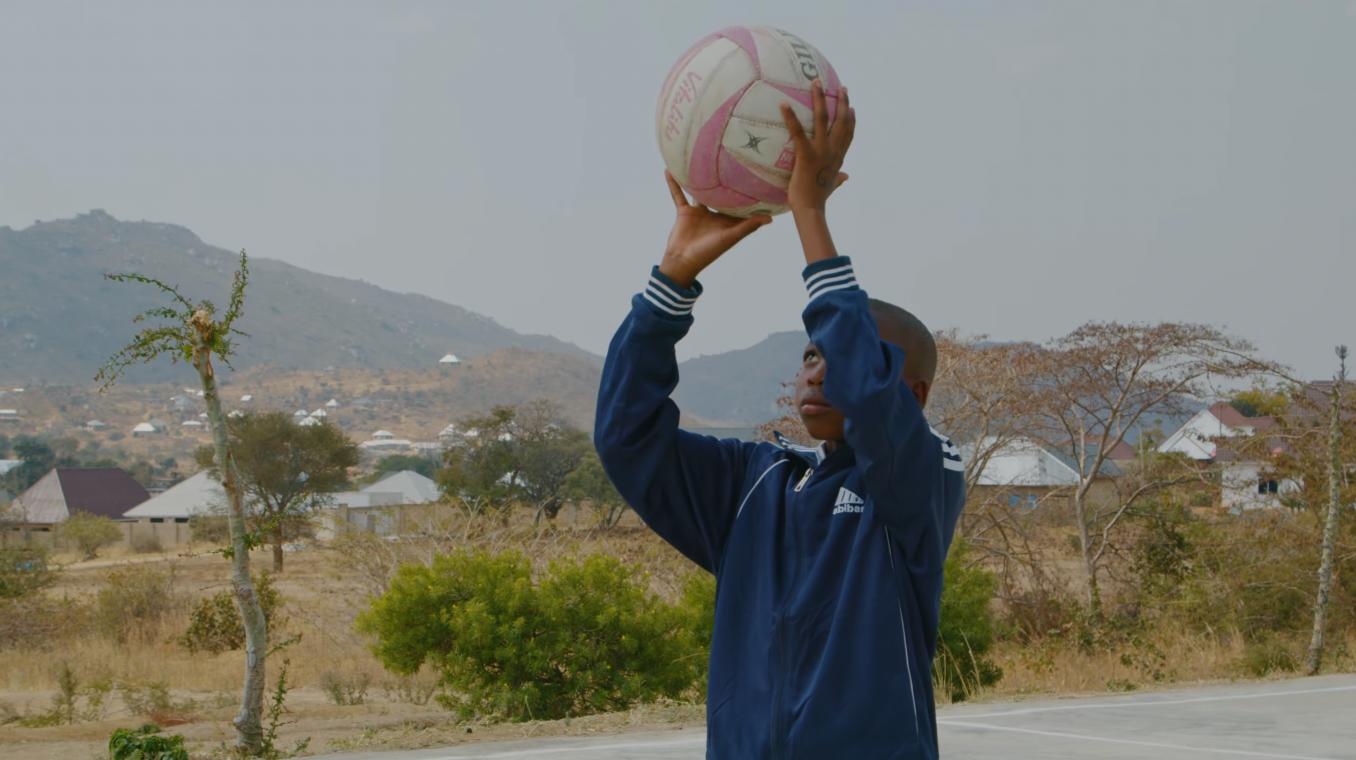 Lining up a shot on a hard court, during a netball trial. Photo: A Tent With a View