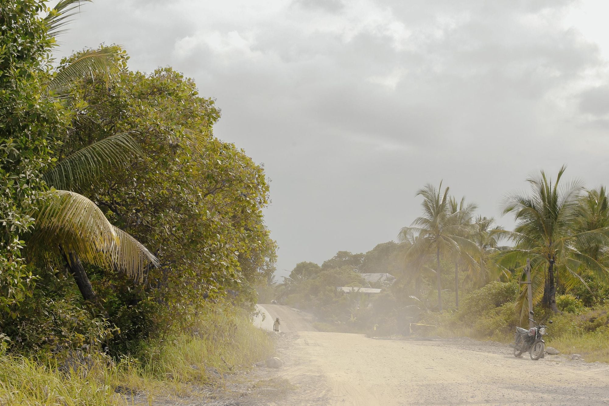 A dusty road in the heat and humidity of Sumatra. Photo: Mirali Shukla