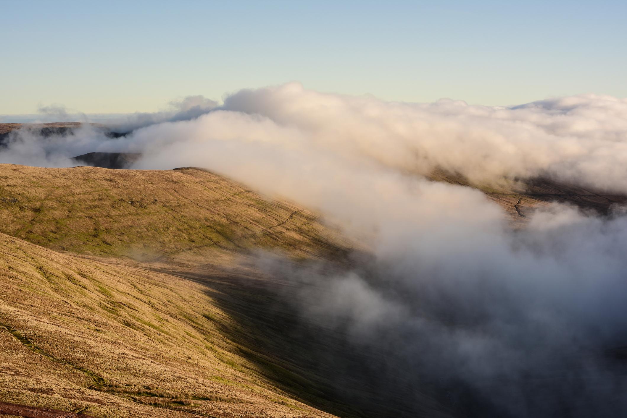 The fog can roll in quickly in the mountains. A view Top view from Pen y Fan in the Brecon Beacons. Photo: Getty