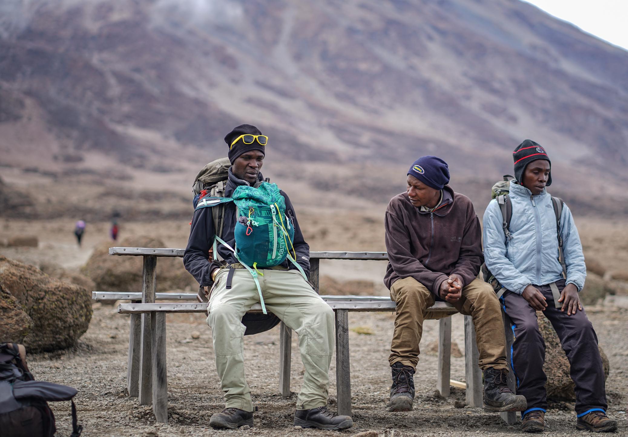 Taking a rest on the ascent of Mount Kilimanjaro. Photo: Getty