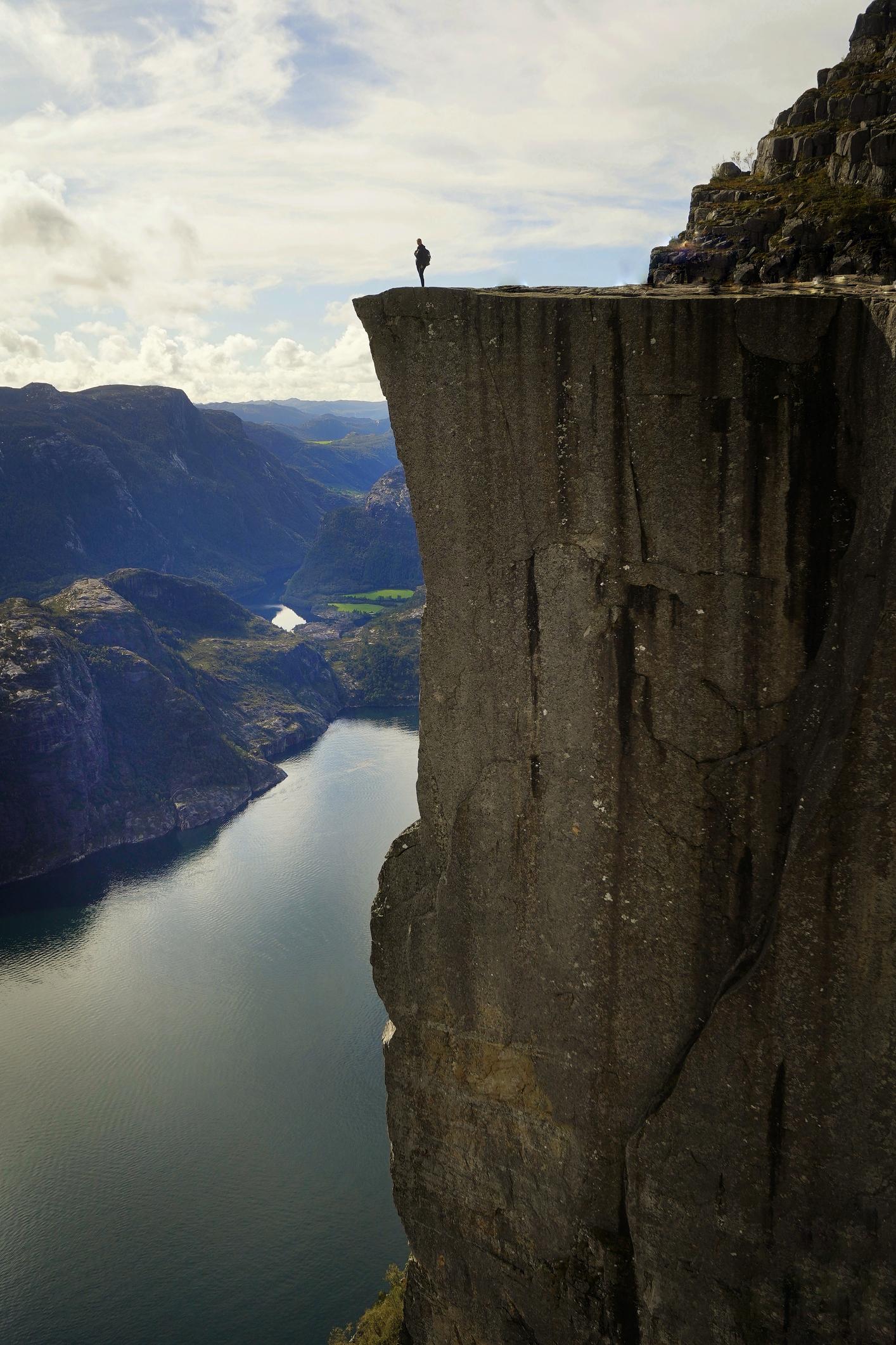 A view from above of Puplit Rock during the day, with a crowd looking out on the fjord. Photo: Shutterstock