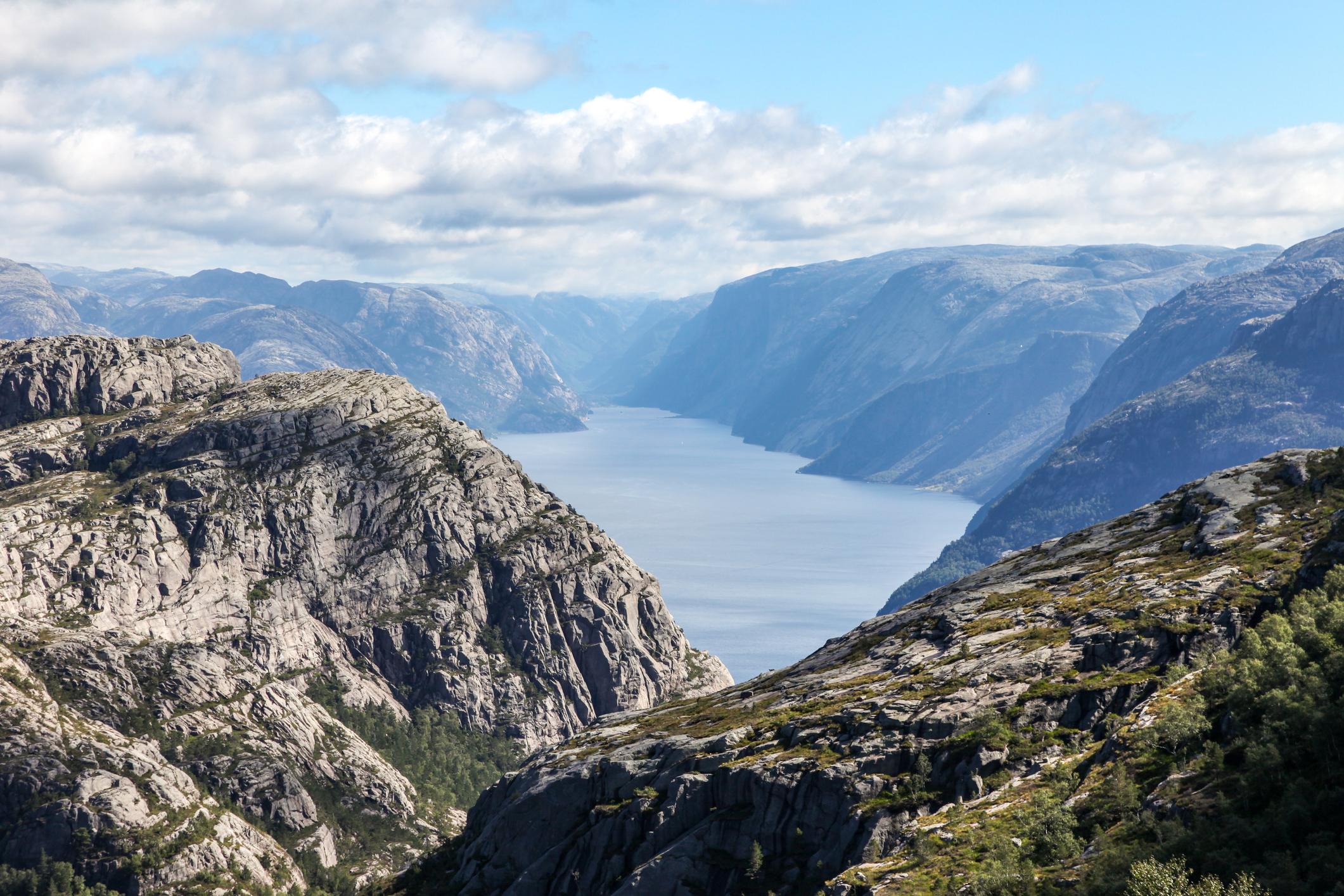The Lysefjord emerges, on the hiking trail to Preikestolen. Photo: Getty
