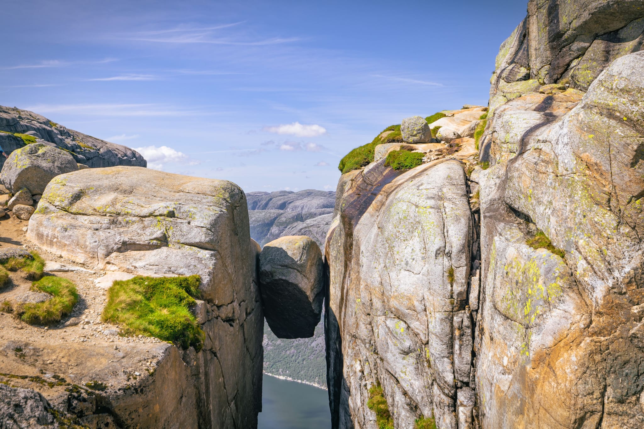 The Kjeragbolten, hanging almost 1000 metres above the fjord below. Photo: Shutterstock
