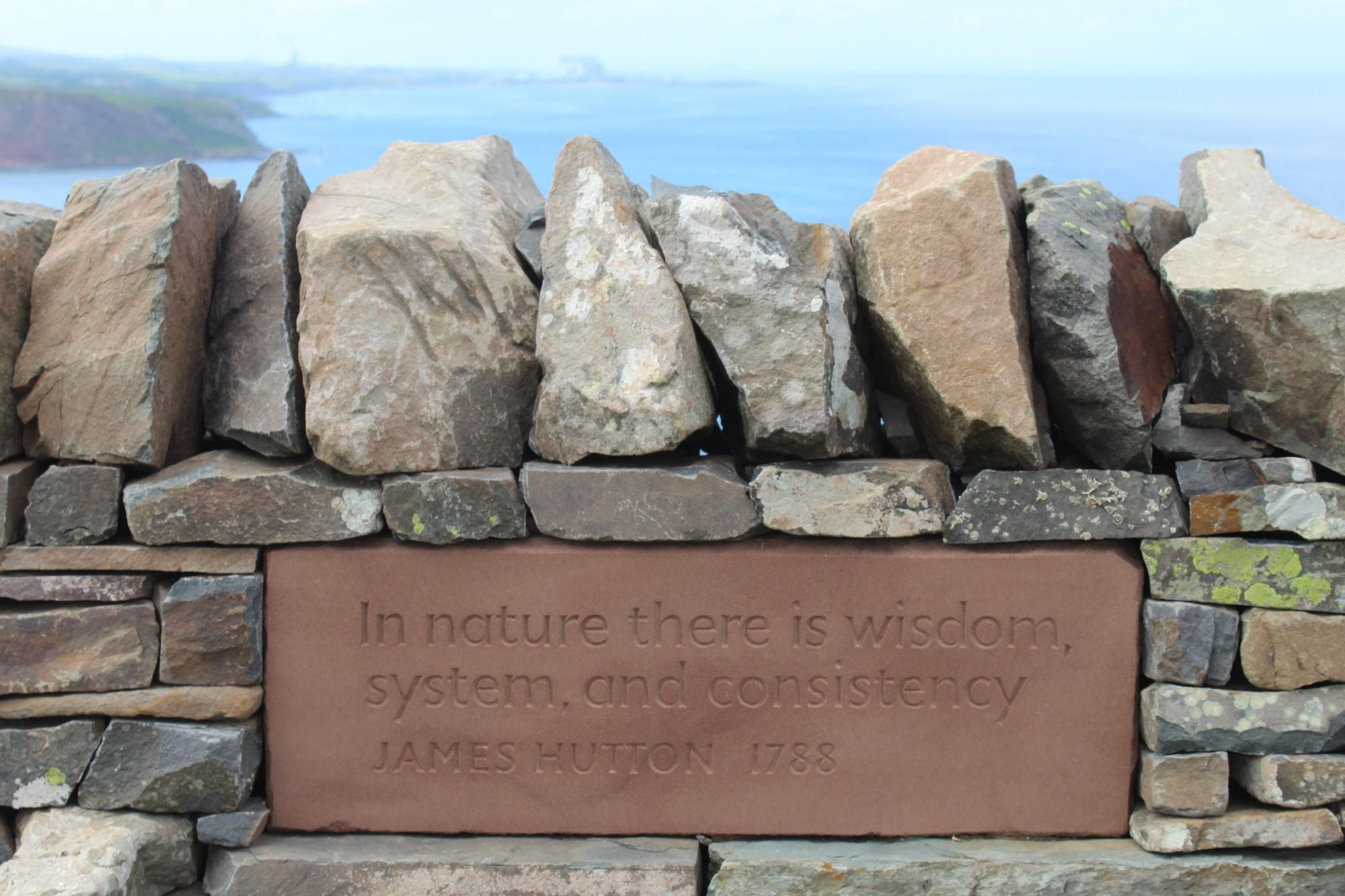 A quote from James Hutton, engraved on a block of red sandstone, in a hand-built dyke wall on the Deep Time Trail. Photo: Stuart Kenny