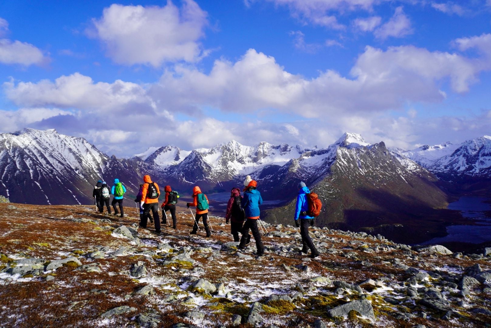 Tough hikes are rewarding with wide, dramatic vistas of the snowy mountains in Lofoten. Photo: Ross Brannigan
