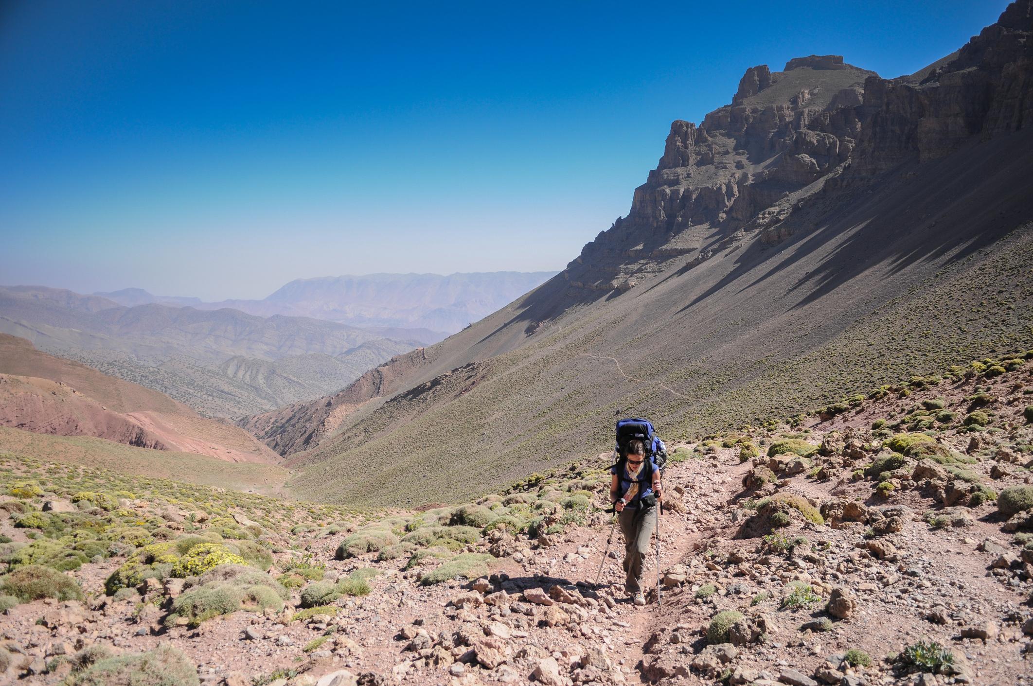 A tourist hiking to the summit of Jabal Toubkal, the highest mountain in the Atlas Mountain range. Photo: Getty