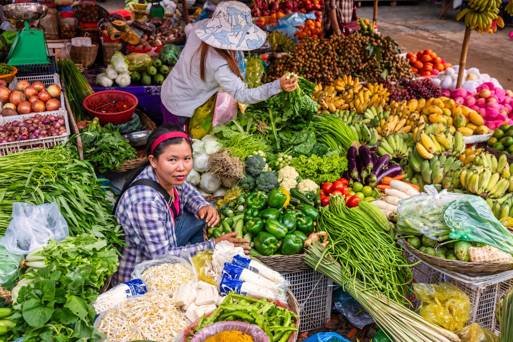 Cambodian women selling fresh fruits and vegetables on a local market in Siem Reap, Cambodia. Photo: Getty