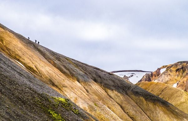 Hikers struggling up the steep climb leaving Landmannalaugar on the Laugavegur Trail